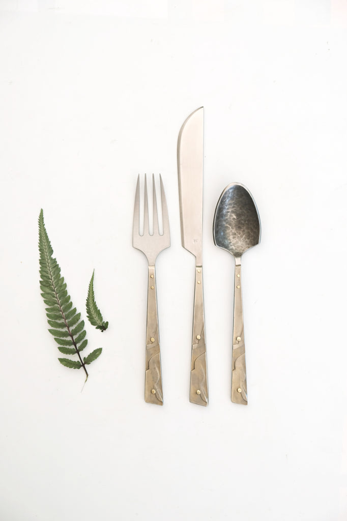 Flatware with brass textured handles